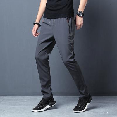 China Casual Joggers Summer Fitness Pants Breathable Slim Running Sweatpants Quick Dry Stretched Side Zipper Pockets Pencil Pants for sale