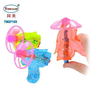 China Toy Super Wind Up Flying Saucer Disc UFO Electronic Gun Toy With Sweet Candy for sale