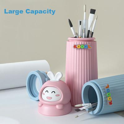 China Fashion Rotating 3D Cartoon Doll Shockproof School Desk Cute Children Pencil Pen Holder For Kids for sale