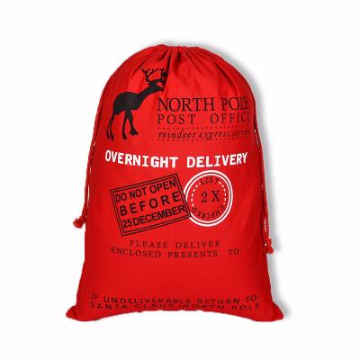 China Wholesale Soft Red Green Large Rope Handle Canvas Drawstring Bag Printing Christmas Gift Drawstring Storage Bags for sale