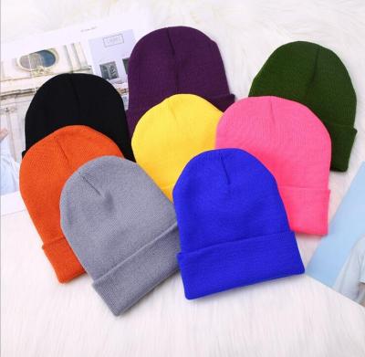 China COMMON High Quality 100% Acrylic Winter Knitted Beanie Hats Best Price Yiwu Qunliang Custom Knitted Winter Beanie Hat Custom Embroidery for sale