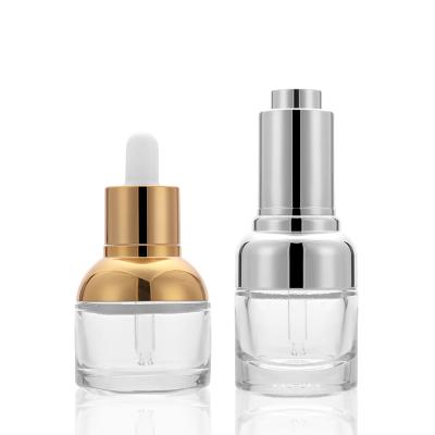 China 30ml Glass Cosmetic Luxury Cosmetic Oil Bottle With Press Pump for sale