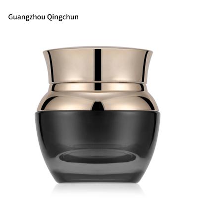 China Manufacturers Cosmetic Wholesale 30G Gradient Black Glass Bottles With Gold Lid for sale