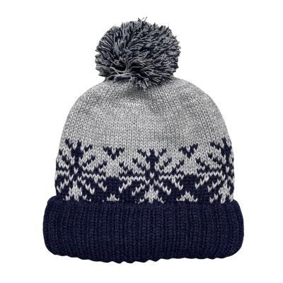 China COMMON Jacquard Pattern Winter Knitted Hat With Warm Soft Lining And 2 Color Pom Pom for sale