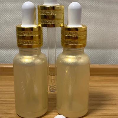 China Cosmetic UV proof glass bottle for cbd oil essential oil bottle UV protect gold violet glass bottle with dropper for sale