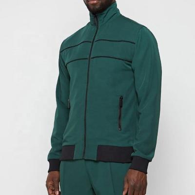 China Breathable Custom Green Logo Streetwear Tracksuit Polyester Emerald Track Jacket Cotton Black Squishy Tracksuit for sale