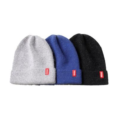 China JOINT Design Your Own Winter Cashmere Beanie Fleece Hand Knit Hat With Custom Label for sale