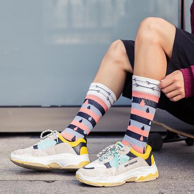 China Hot sale border Sweat-absorbent mi t happy socks sports socks new products autumn and winter men's straight fashion tube tops terry socks for sale