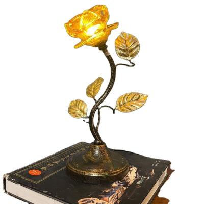 China Modern Dimmable Novelty Metal Brass Gold Flower Bedroom Bedside LED Table Light for sale