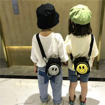 China Fashion Wholesale Cartoon Smile Children Shoulder Messenger Bag 2021 New Korean Version Boys And Girls Casual Canvas Bag Women Small for sale