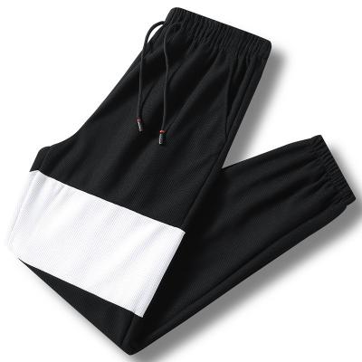 China Large Size Breathable Oversized Casual Pants Men's Loose Sports Pants Lightweight Pants Quick-drying Breathable Fitness Pants for sale