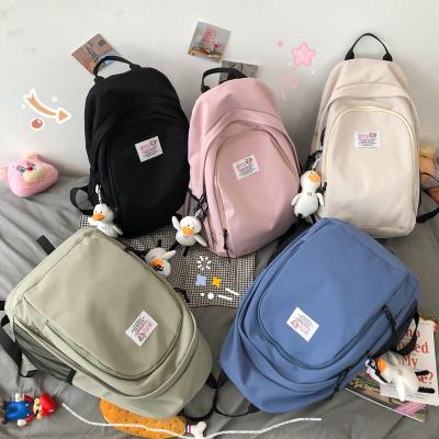 China Factory Price Classic Solid Color Girl Waterproof Water Proof Portable School Bag Large Capacity Casual Students Backpack for sale