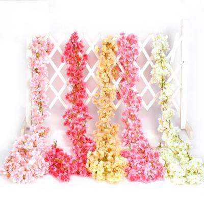 China Cherry Blossom Artificial Silk Flower Cherry Blossom Cane 144 Flower 135 Romantic Artificial Cherry Blossom Cane Decorative Garland for sale