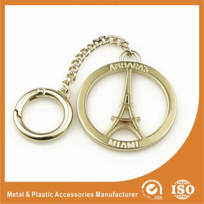 China Etiquetas de encargo del logotipo del metal del tamaño del oro del hueco de encargo de la torre Eiffel para los bolsos accesorios en venta