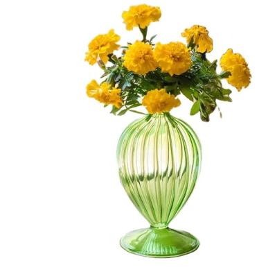 China Minimalist custom colorful creative ribbed glass vase with round body for home arrangement for sale