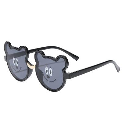 China New Fashion Kids Sunglasses Candy Color Bear Frame Glass Kids Sunglasses Lovely for sale