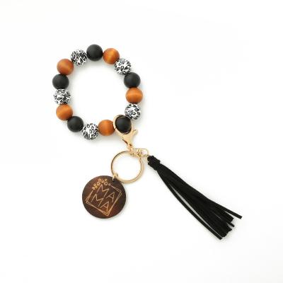 China Hot Selling BOHEMIA New Design High Quality Wooden Bead Bracelet Bangle Key Chain Key Chain With Tassel for sale