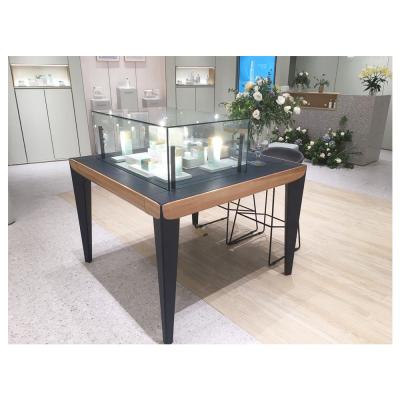 China Eco-friendly Modern Cosmetic Display Table Top Black Wooden Leg And Glass Table Top Display For Cosmetic Shop for sale