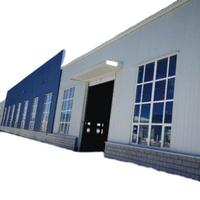 China Industrial Prefabricated industrial metal building kit, steel door frame workshop, prefabricated steel structure warehouse building for sale