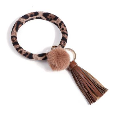 China Leather Key Chain Pom Pom Tassel Leopard Bracelet Keyring Keychain PU Leather New Arrival for sale