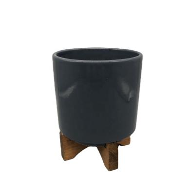 China Modern Garden Flower Pot Glazed Ceramic Pot Wooden Stand Navy Flower Planter 5 Inch for sale