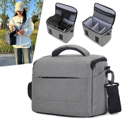 China Waterproof best cool small black gray canvas crossbody waterproof photography camera sling bag for hiking travel with soft handle for sale