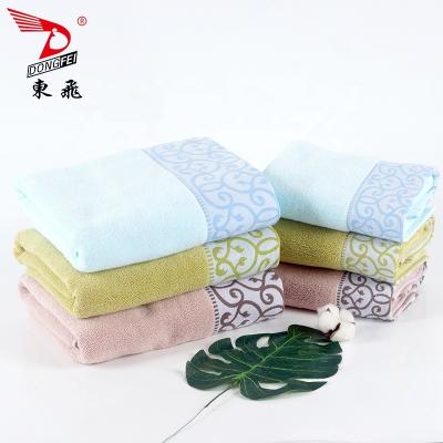 China Hot sale luxury home use jacquard flower border pattern soft soaking water good towel for sale