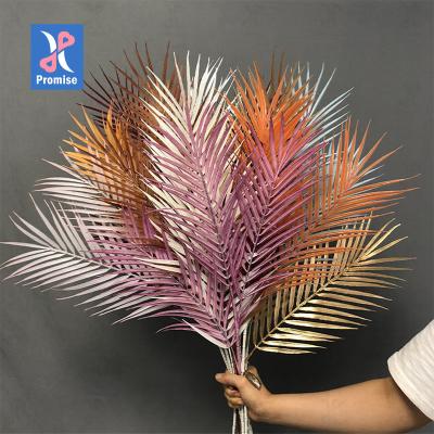 China Natural Single Plastic Stalk Promise Palm Leaf Artificial Colored Plastic Scattered Leaves For Home Wedding Decoration for sale