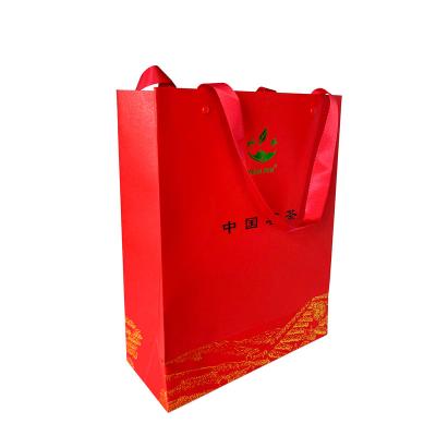 China Recyclable Wholesale Supplier Hand Length Handle Paper Bag Paper Bags With Your Own Logo for sale