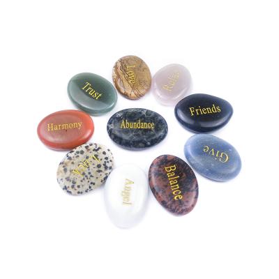 China Gemstone Seven Chakra Bonded Worry Stone Irregular Natural Stone Carved Letter Palm Stone for sale