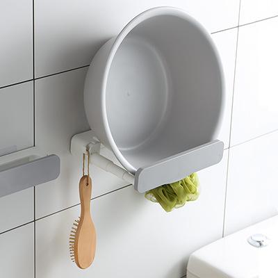 China Creative Wall Mounted Retractable Retractable Sink Rack Pot Cover Stand With Hook Brush Hanger for sale