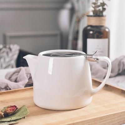 China Macaron Viable Nordic Creative Color Ceramic Kettle With Strainer Flat Bottom Household Living Room Boiling Water Heat Resistant Teapot for sale