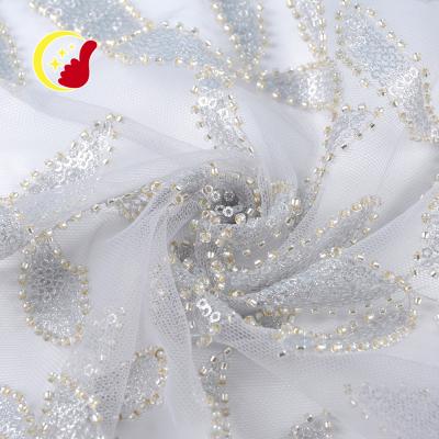 China Good quality viable custom lace sequin evening dress embroidery net fabric beaded for wedding for sale