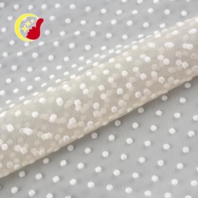 China Customized 75D Polyester 100% Anti-Static Flocked White Dot Mesh Net Fabric For Dress for sale