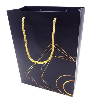 China Outdoor Waterproof Wholesale Custom Paper Bag Printed Kraft Gift Craft Shopping Paper Bag With Handles for sale