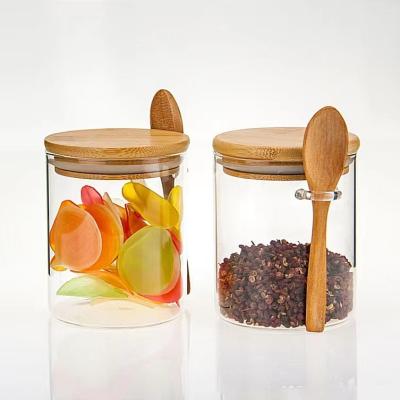 China Storage Preservation Round Shape Food Storage Container Glass Jar With Bamboo Lid And Wooden Spoon for sale