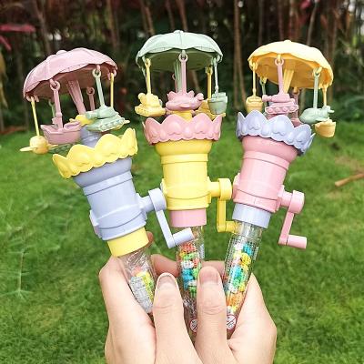 China Cartoon Toys Surprise Gift Light Up Mini Manual Merry-Go-Round Candy Toy Popular Novelty Super Joyful Vanish Round Toy Candy For Kids for sale