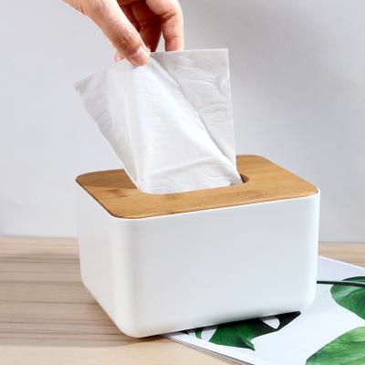 China Minimalist bamboo and wood cover paper napkin creative advertising box plastic cardboard box can add logo hotel living room napkin box for sale