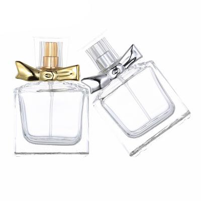 China 30ml LOGO Cosmetic Custom Gold and Silver Bow Cosmetic Empty Perfume Spray Bottle for sale