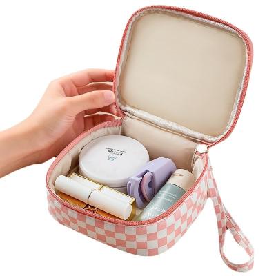 China Waterproof Direct Selling Waterproof Travel Storage Checkered Makeup Bag Portable Simple Pu Small Cosmetic Bag for sale