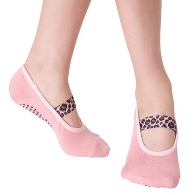 China Antibacterial pink yoga socks with non slip handles leopard strap, perfect for Pilates, barre, ballet, barefoot training for sale