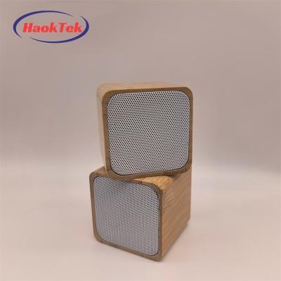 China HAOKTEK Logo Bamboo Wood Colorful Led Light Small Flashing Light Bluetooth Cube Speaker For Home Party for sale