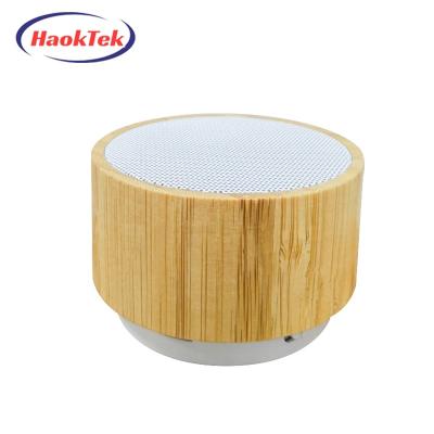 China HAOKTEK Wireless Mini Round Wireless Speaker Outdoor Wooden Portable Mini Speaker for sale