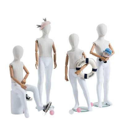 China White Fabric Flexible Child Mannequin Natural Posture With Wooden Arms for sale