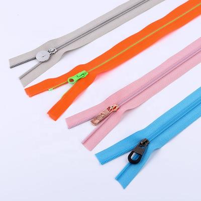 China Custom High Quality Double Coil #5 Nylon Sliders Zipper By The Yard Nylon Rainbow for sale