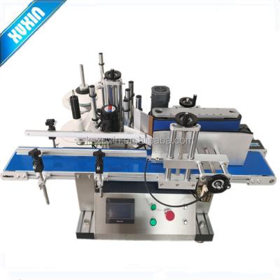 China CLOTHING round bottle tabletop labeling machine X-210T; small automatic labeling machine for sale