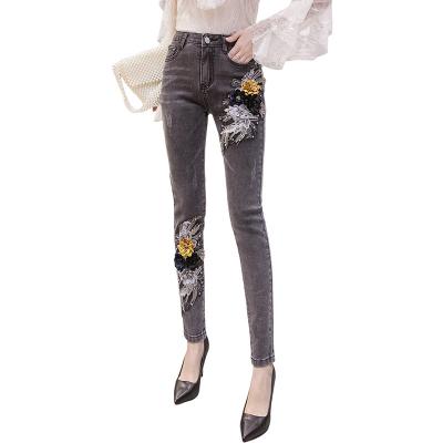 China Autumn new breathable winter Europe American black jeans nail beaded flower foot pants personality small stylish nail beaded pencil pants for sale