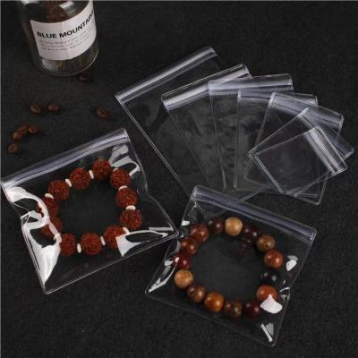 China Jewelry Package Customized Clear Plastic Holders Single Pocket Zip Lock Earrings Jewelry Packaging Storage Pouch Pvc Zipper Bag for sale