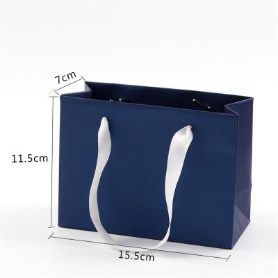 China Recyclable Luxury Black Gift Paper Bag Custom Printed Logo For Shoes Clothes Shopping Wedding Gift Jewelry Packaging With Ribbon Handles for sale