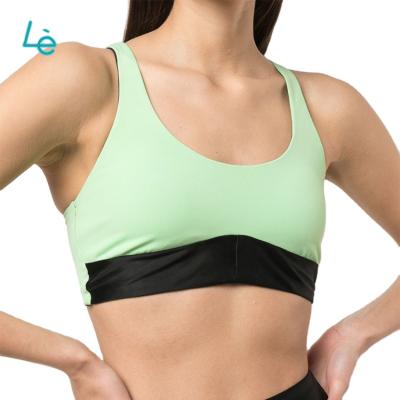 China Women's Private Label Breathable Sports Bra Strappy Yoga Solid Color Cut Up Sports Bra Custom for sale